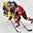 PLYMOUTH, MICHIGAN - April 1: Sweden's Michelle Lowenhielm #28 races Laura Benz #21 for the puck during preliminary round action at the 2017 IIHF Ice Hockey Women's World Championship. (Photo by Minas Panagiotakis/HHOF-IIHF Images)